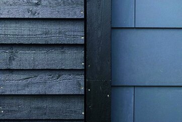 Træ og fibercement i samspil på facade